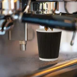 8oz black ripple wall paper cup in use