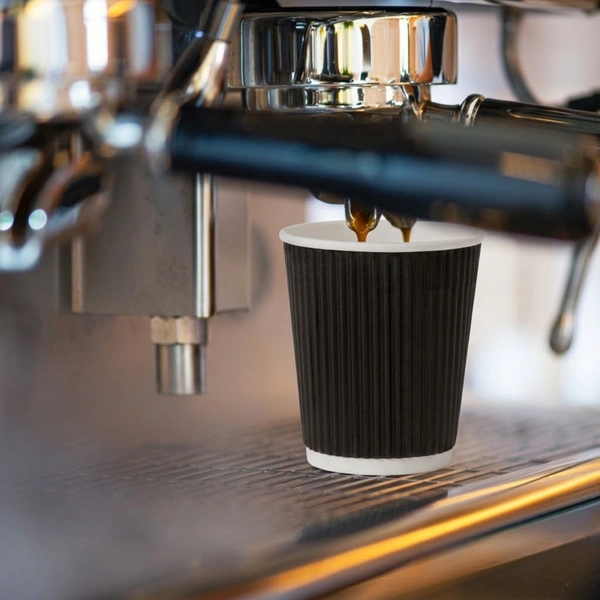 8oz black ripple wall paper cup in use 8oz black ripple wall paper cup in use