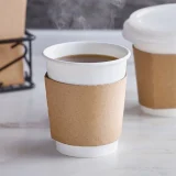 8oz recyclable kraft brown paper cup sleeve in use